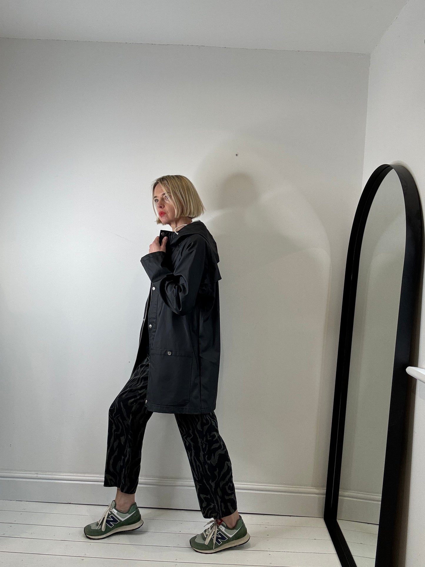 Rubber hooded rain mac