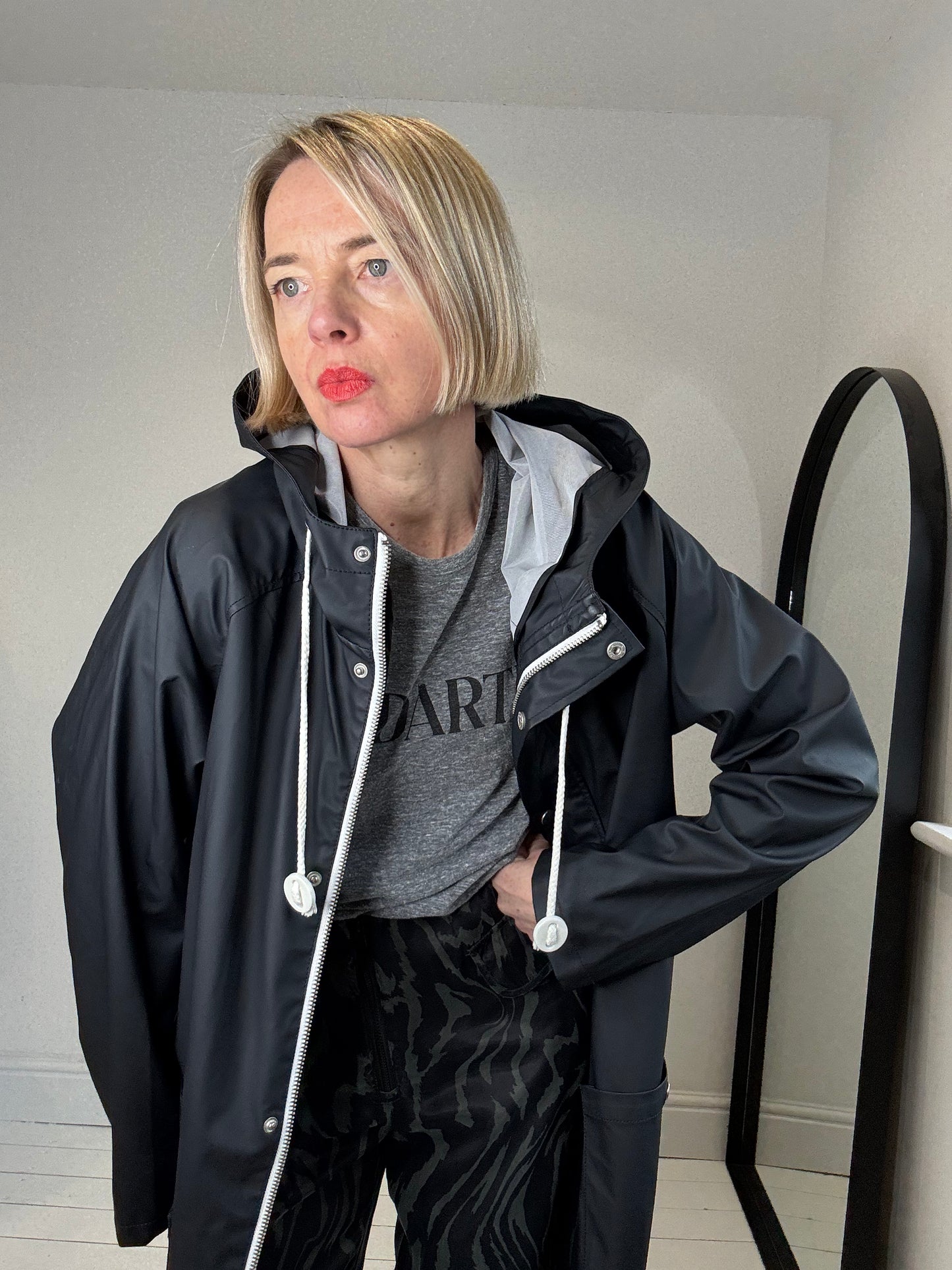 Rubber hooded rain mac