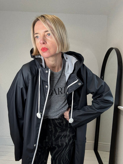 Rubber hooded rain mac